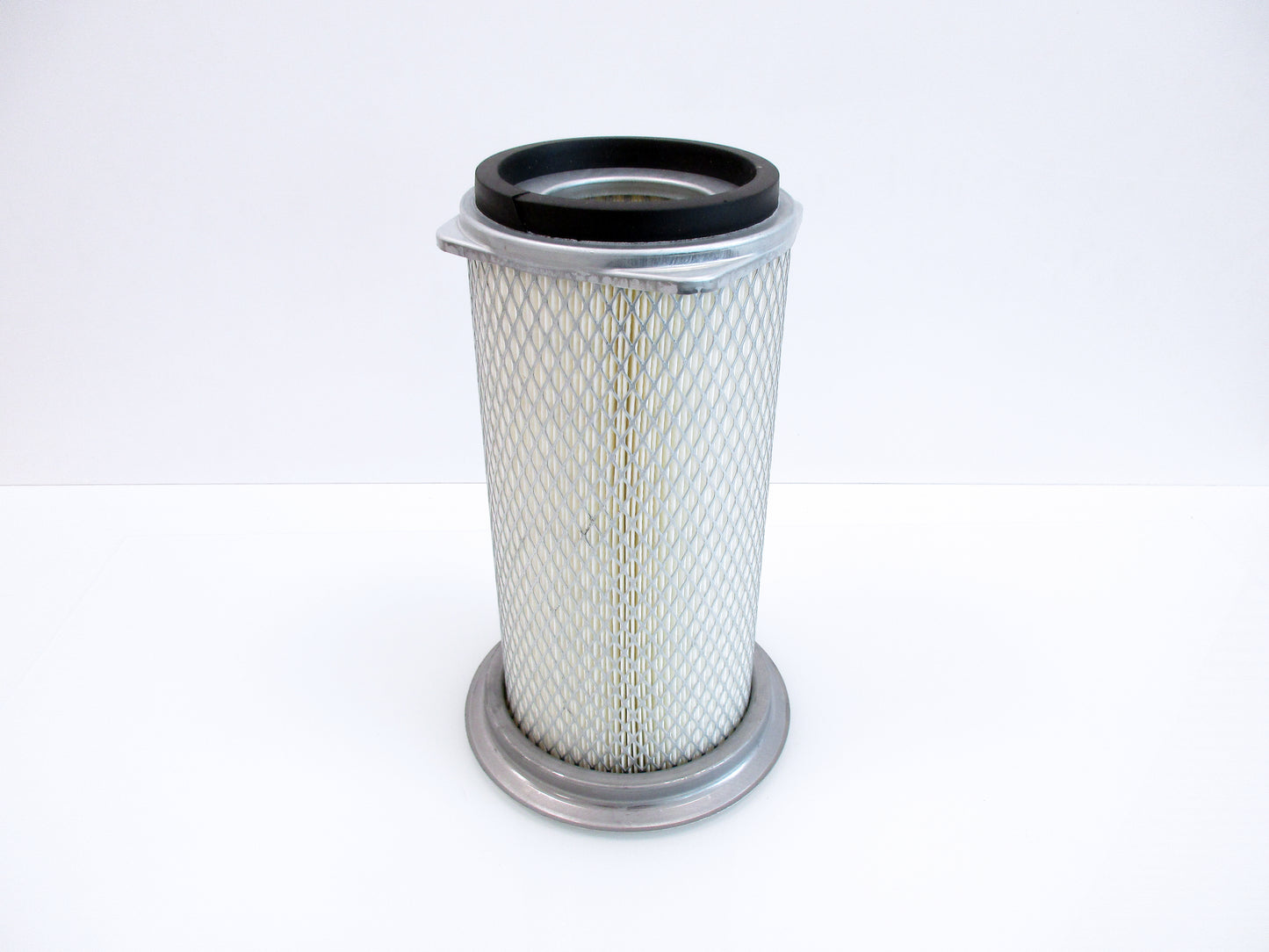 A cylindrical pleated air filter with a grey metal mesh body, a black rubber gasket at the top, and a grey metal base, shown on a plain white background.