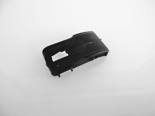 A black plastic air cleaner dust cup clip replacement part, shown on a plain white background.