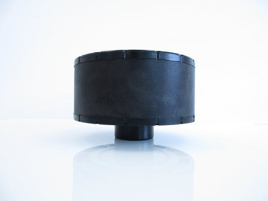 A black cylindrical plastic air cleaner with a stepped top rim, shown on a reflective white surface against a white background.