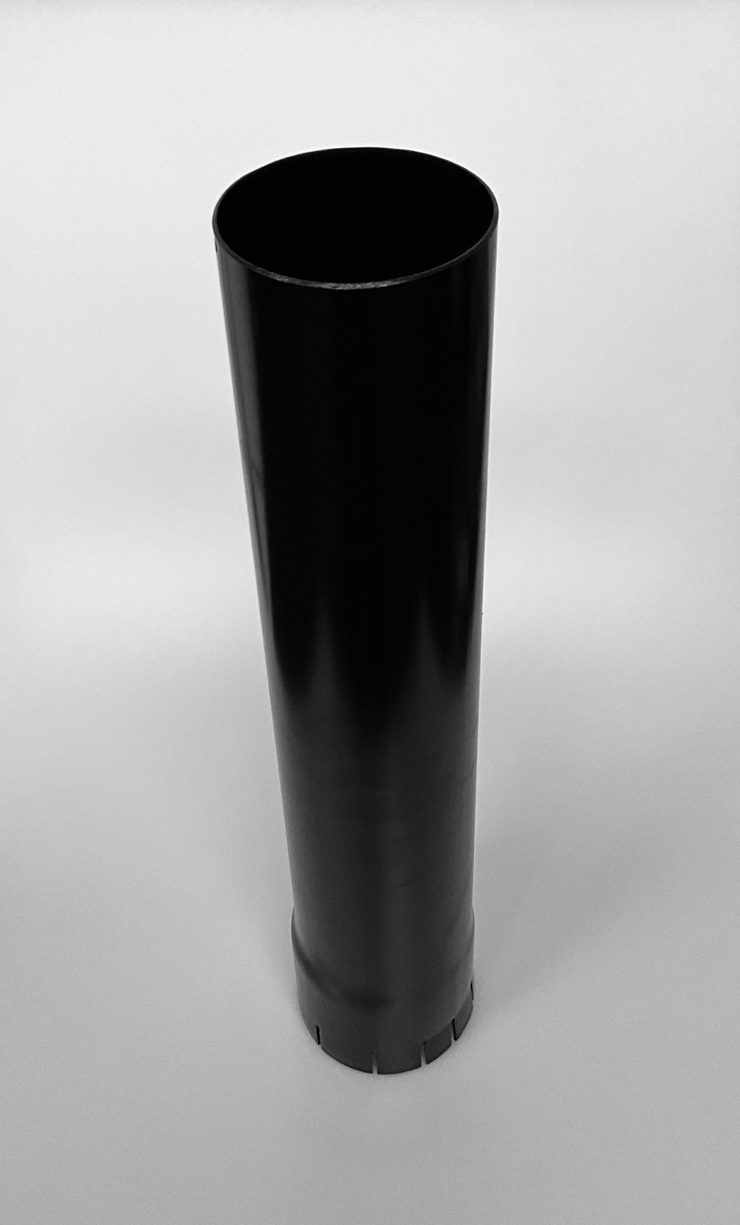 A black metal cylindrical pipe, shown on a light grey background.