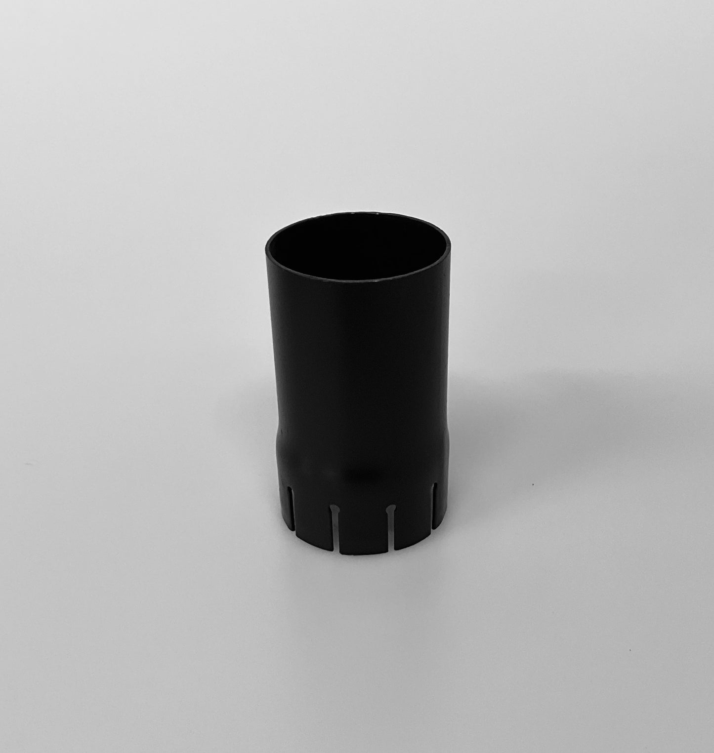 A black metal cylindrical pipe, shown on a light grey background.