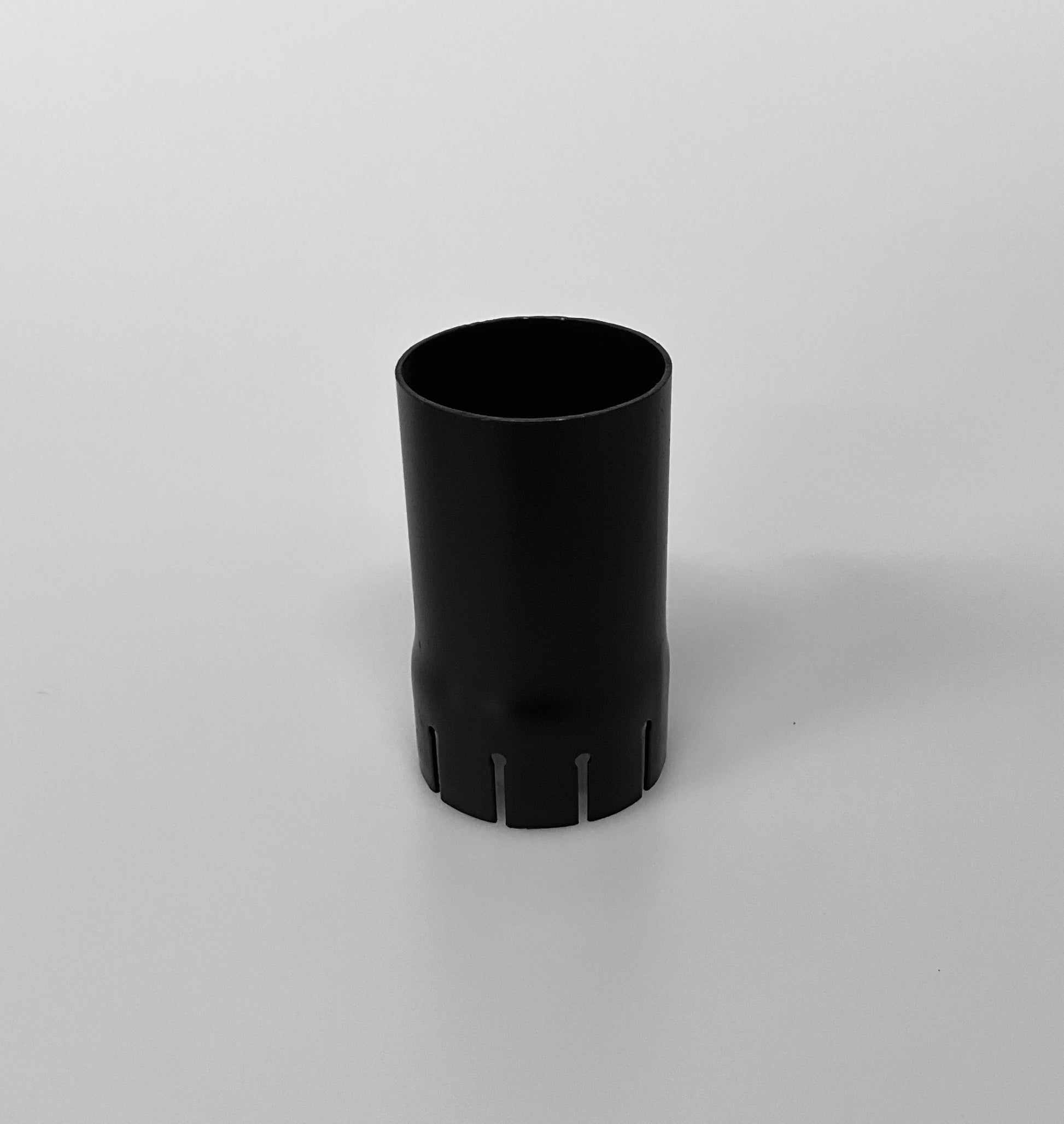 A black metal cylindrical pipe, shown on a light grey background.