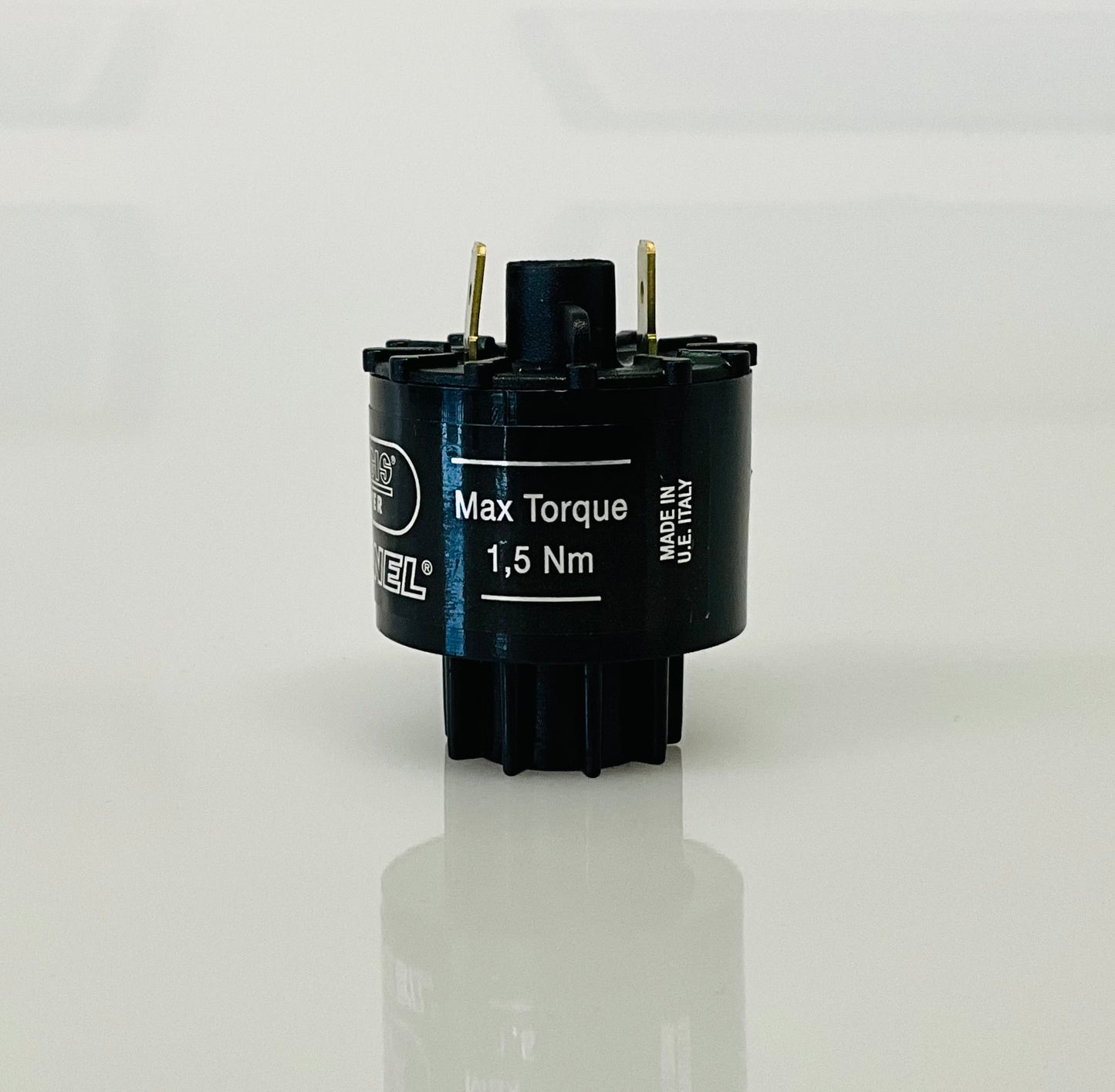 A small black cylindrical electrical indicator with two metal pins at the top, labelled 'Max Torque 1,5 Nm' and 'MADE IN U.E ITALY', photographed on a clean white background with a soft reflection below.