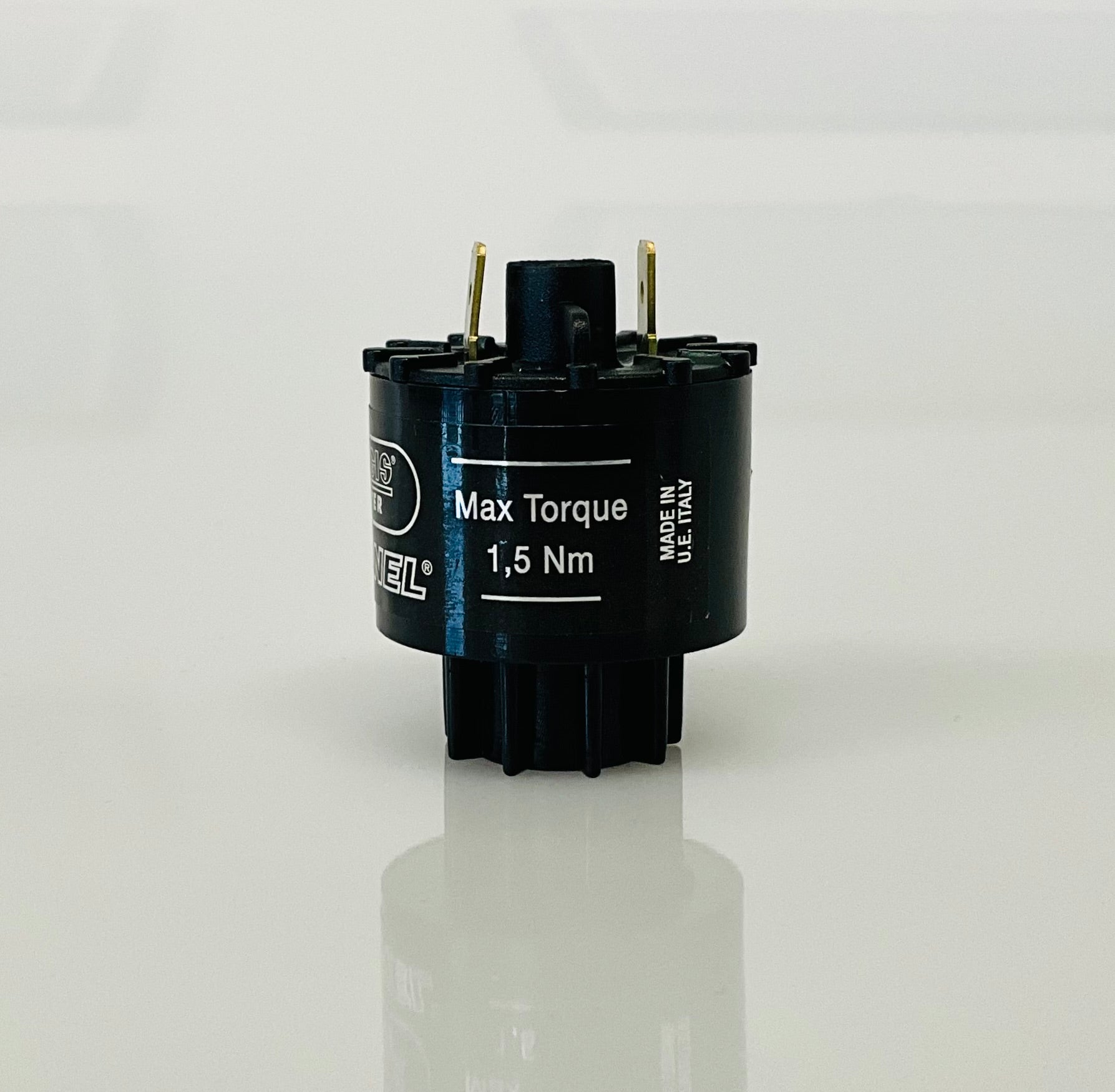 A small black cylindrical electrical indicator with two metal pins at the top, labelled 'Max Torque 1,5 Nm' and 'MADE IN U.E ITALY', photographed on a clean white background with a soft reflection below.