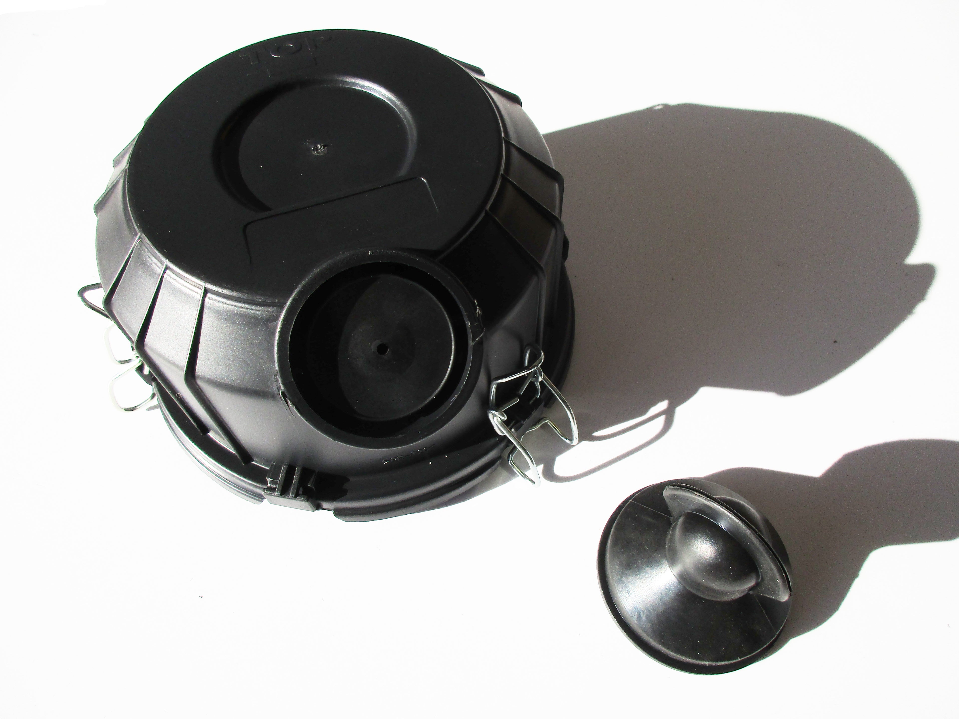 A black plastic air cleaner dust cup, with a black vacuator valve, on a white background.